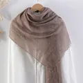 Wrinkled cotton linen blend scarf in tan brown with elegant frayed edges on white shirt - Coffee