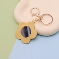 Yellow flower shaped PU leather keychain with built-in mirror and gold-tone hardware - Flower Yellow