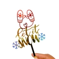 Close-up of a Merry Christmas acrylic cake topper featuring red gloves and let it snow text - Let It Snow Gloves