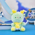 Close-up of a cute green plush dragon with a yellow scarf in a nautical scene - 12cm / Sitting Scarf Dragon