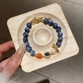 Blue sodalite beaded bracelet with orange stone, pearl and gold pendant on wooden tray - 17# Bracelet - Gold Blue Lotus