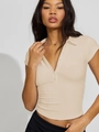 Slim fit beige polo shirt for women featuring V-neck buttons and short sleeves - S / Apricot
