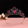 Detailed close-up of baroque crown with black crystals and pink teardrop gemstones - No.2 Antique Gold (Rose Red Stone)