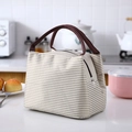 Striped insulated lunch bag in beige and white with durable brown woven handles - Beige