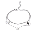 Double-layered stainless steel star bracelet with silver and black charms on white background - Silver