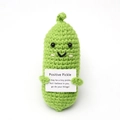 Handmade green crochet positive pickle doll with motivational message on a white background - Sprout Green Pickle with Positive Card
