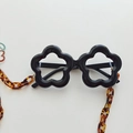 Kids' black flower sunglasses featuring a stylish tortoise shell textured chain strap - With Chain Strap / Black