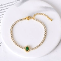 Elegant gold titanium steel bracelet with white zircons and an emerald green oval stone - Green Zircon Oval