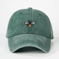 Close-up of bee embroidery detail on forest green washed cotton baseball cap - Adjustable / Dark Green