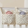 Double-pocket cotton gauze crib organizer bag with cherry print in beige color - Little Black Flower