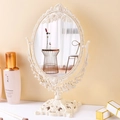 Vintage oval desktop vanity mirror with floral relief and baroque base in ivory white - European Vintage / Beige