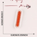 Small orange embroidered letter patch with white border and 2.5cm length dimensions - Letter-L