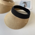 Detail of straw sun visor featuring fine weave texture and elastic band with metal leaf logo - Adjustable / Black