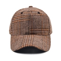 Close-up of wool plaid baseball cap showing premium brown checked fabric and stitching - Brown Plaid