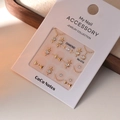 Detailed view of 3D gold bow nail art stickers with crystal rhinestones and chain elements - MJ-015 Gold Bronzing