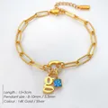 Elegante 14K goud vergulde rvs armband met letter g bedeltje en blauw kristal detail - Letter G / Staalkleur