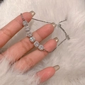 Detail of adjustable silver bracelet with square halo cubic zirconia on plush white background - Six Square Halo Inlaid Main Stones / Silver
