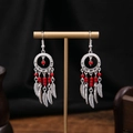 Bohemian silver earrings with red beads and feather charms on display stand - E1405-1 Red Dreamcatcher Feather