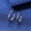 Detail of adjustable couple rings featuring a twisted band and one with small inset stones - Trendy Twist and Zirconia Style (QL-006)