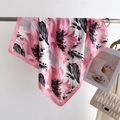 Close-up of a floral silk square scarf with pink and black petals hanging on a metal bar - 66-70cm / Pink (FJ967-2)