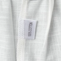 Detailed close-up of 100% cotton fabric texture and sewn material label on the white dress - S / Off White