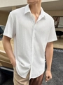 Detail of men's short sleeve white shirt featuring textured water ripple fabric and collar - S / Tops / White
