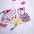 Traditional bamboo folding fan with purple floral patterns and a matching silk tassel - White and Purple Floral Women's Fan Style 42