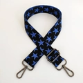 Close-up of black knit bag strap with blue stars and gunmetal adjustable buckles - Black Base Blue Star Gunmetal Buckle