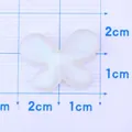 Pearly white translucent resin butterfly charm for DIY crafts measuring 2cm by 1.5cm - White
