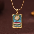 Golden tarot necklace with light blue 'THE SUN' pendant and multi-colored zircons - Gold (X6040GD)