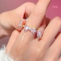 Golden bow ring with pink heart-shaped crystals and small diamonds on the finger - 14K Gold Bow Heart Ring (G-424) / Pink