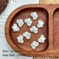Detail of 13x10mm pearl white butterfly beads for DIY jewelry making on wooden tray - Irregular Cloud (13*10mm)