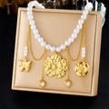 Close-up of gold-plated tassels with floral, butterfly, and heart charms on a pearl necklace - Butterfly Flower Heart Style (N3662)
