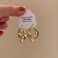 Minimalist twisted S925 sterling silver hoop earrings with a polished golden finish - Twisted Ribbon Hoop Earrings - A2791 Gold