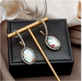 Golden oval stud earrings with iridescent opal stones and white crystal halo - Gold Oval Iridescent Gem Earrings