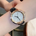 Elegant women's watch with gold diamond dial and black leather strap on wrist - Rose Gold Case Black Leather