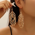 Elegant long gold hollow leaf drop earrings featuring a modern layered statement design - Willow Feather Shape / KC Gold