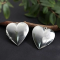 Polished silver heart-shaped locket pendant made of stainless steel displayed on wood - Heart Smooth Locket 40*42mm / Raw Blank