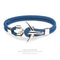 Close-up of navy blue Milan rope bracelet with a silver airplane charm on white background - Teal Rope Silver Airplane