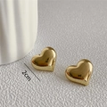 Macro view of 2cm polished gold heart stud earrings with mirror finish and sizing details - Gold