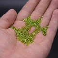 DIY transparent green glass seed beads for handmade jewelry on palm - 2mm / 15g / Light Green