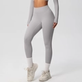 Detailed view of high waisted light grey yoga leggings showing seamless fit and elastic fabric - 7100 Trousers - Frost Grey / S