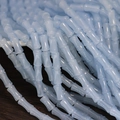 Light blue bamboo-shaped glass beads for DIY bracelet making on a wooden desk - 6x12mm Very Light Blue (1Pc)