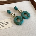 Deep green marbled acrylic drop earrings with gold metal beads on linen display - Silver Earring Post-Green