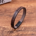 Detail of brown PU leather bracelet with embossed feather texture and black magnetic clasp - Dark Brown
