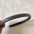 Detail of dark grey leather headband showing textured PU material and minimalist design - Gray