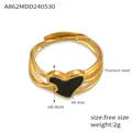 Detail of titanium steel ring with black enamel heart and oil drip craft texture - Size 7 (Adjustable) / Gold