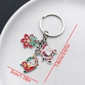 Christmas keychain with Santa Claus and Snowman pendants in silver finish with dimensions - ER830-White K Enamel Santa Skiing Reindeer Snowflake Keychain