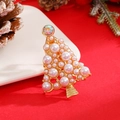 Detailed close-up of golden Christmas tree brooch with white pearls and sparkling rhinestone - Gold Pearl Style (12251)