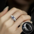 Adjustable silver ring with vintage striped texture and blue oval gemstone inlay - Blue Gemstone Surrounded/Striped Band